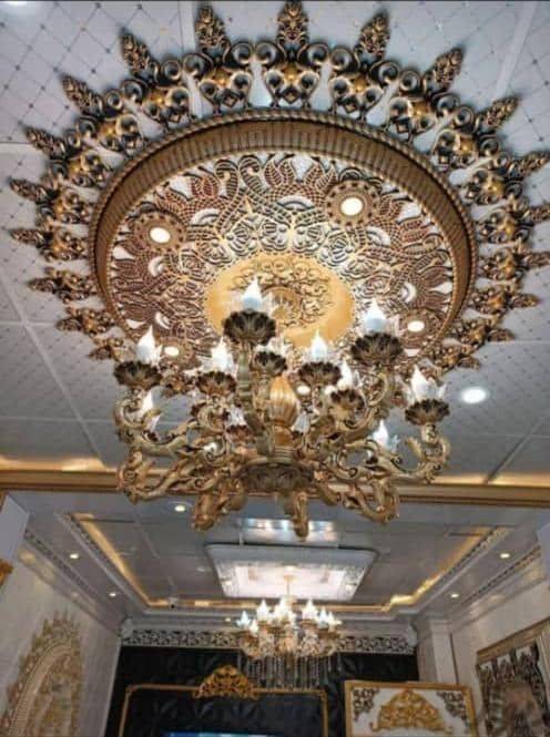 قیمت گل سقفی زیرلوستری دورلوستری پیش ساخته تزیین سقف دایره مدل ترنج 106 سانتی پی وی سی سپاهان سقف  طلایی مشکی